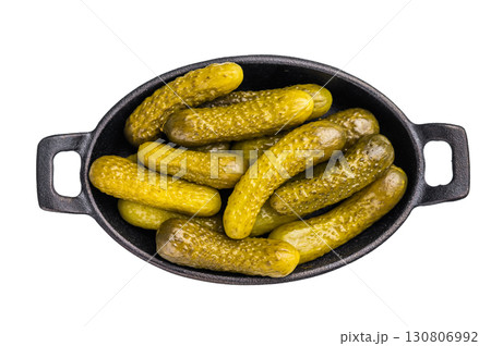 Homemade brined cucumbers, Pickled Gherkins, offering a deliciously crunchy bite that complements any dish or appetizer platter. isolated on white background Homemade brined cucumbers, Pickled Gherkins, offering a deliciously crunchy bite that complements any dish or appetizer platter. isolated on white background 130806992