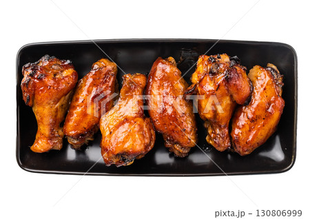 Juicy barbecue chicken wings, perfectly grilled and glazed, ideal for your next summer cookout or party. isolated on white background. top view 130806999