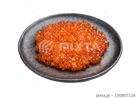 Luxurious red caviar, glistening pearls of flavor, perfect for elevating any gourmet dish or appetizer. isolated on white background. top view 130807116