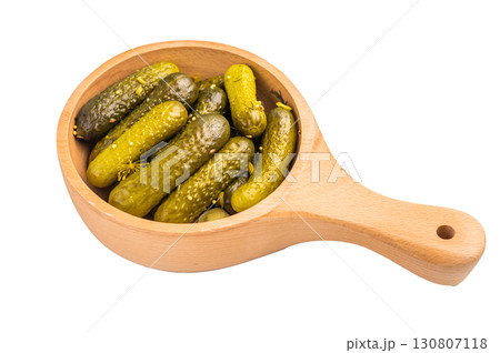 Pickled Gherkins beautifully arranged and ready to elevate your culinary creations with their bold taste. isolated on white background. top view Pickled Gherkins beautifully arranged and ready to elevate your culinary creations with their bold taste. isolated on white background. top view 130807118