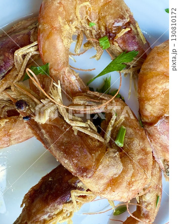 Close-up of crispy fried shrimp dish. Healthy seafood cooked at home. 130810172