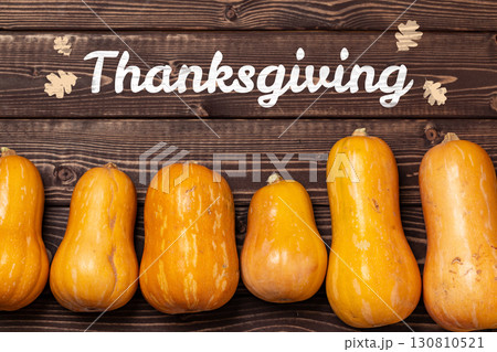 Festive arrangement of pumpkins for Thanksgiving celebration on wooden background 130810521