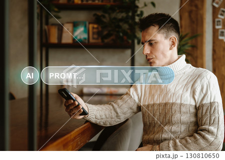 Man in a cozy sweater engages with a smartphone in a modern cafe during daytime, showcasing a relaxed atmosphere and technology use Man in a cozy sweater engages with a smartphone in a modern cafe during daytime, showcasing a relaxed atmosphere and technology use 130810650