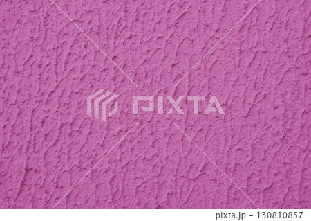 Rough pink colored concrete or plaster wall texture background 130810857
