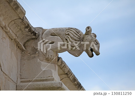Decorative gargoyle at Monastery Santa Maria in Alcobaca, Portugal showcases medieval craftsmanship Decorative gargoyle at Monastery Santa Maria in Alcobaca, Portugal showcases medieval craftsmanship 130811250