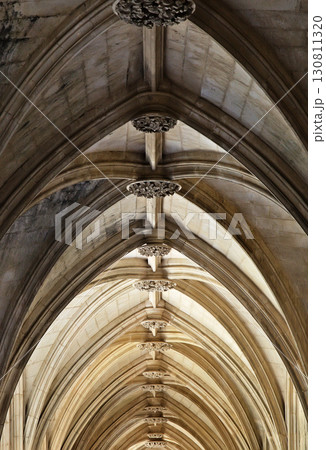 Gothic arches and intricate details of Batalha monastery in Portugal 130811320