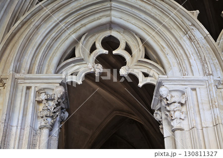 Architectural details of Batalha monastery in Portugal showcasing gothic design Architectural details of Batalha monastery in Portugal showcasing gothic design 130811327
