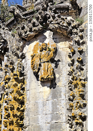 Carved angel figure on the facade of Convento de Cristo in Portugal 130811700
