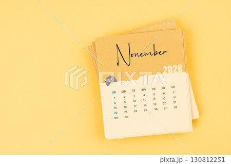 November 2026 calendar card on yellow color background with copy space. November 2026 calendar card on yellow color background with copy space. 130812251