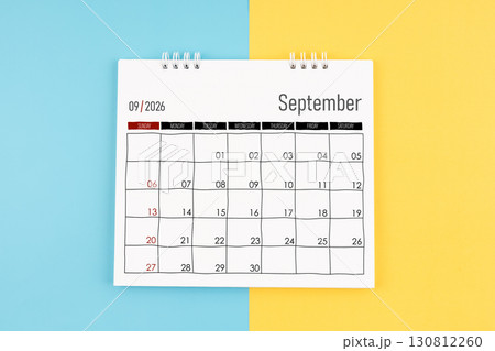 September 2026 calendar on blue and yellow color background, Flat lay. September 2026 calendar on blue and yellow color background, Flat lay. 130812260