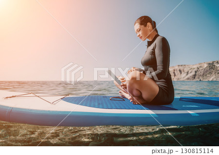 Woman Laptop Paddleboard Working Remotely on Sea Woman Laptop Paddleboard Working Remotely on Sea 130815114