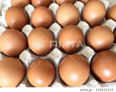 Eggs in paper tray, top view. Fresh farm eggs in eco packaging, organic food, healthy eating video concept 130815214