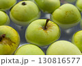 Fresh green apples in bowl. Ripe apples in water. Autumn harvest. Organic fruits background. Heap of green apples. Raw dieting. Natural vitamin. Healthy eating concept. Natural snack. 130816577
