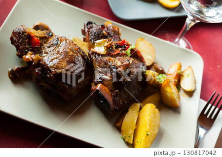 Appetizing fried pork cheeks with potatoes Appetizing fried pork cheeks with potatoes 130817042