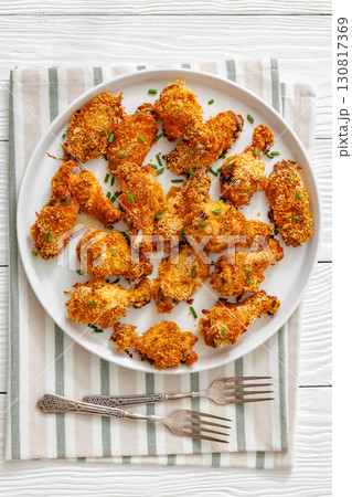Panko breaded oven baked chicken wings on plate 130817369