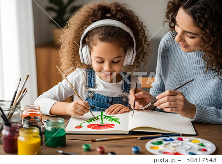Neurodivergent kid girl with headphone in art therapy painting red flower with therapist for creativity motor skills and autism spectrum inclusion awareness 130817548