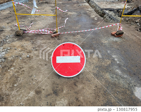 Round red sign: road closed due to repairs. Round red sign: road closed due to repairs. 130817955