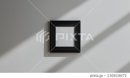 Minimalistic still life photography of a black frame with a solid white center on a light gray wall with shadows Minimalistic still life photography of a black frame with a solid white center on a light gray wall with shadows 130818072
