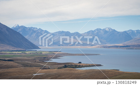 Alpine landscape with mountain ridges towering above turquoise lake, New Zealand 130818249