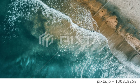 Aerial view turquoise waves crashing sandy beach foamy natural coastal Aerial view turquoise waves crashing sandy beach foamy natural coastal 130818258