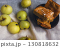 Apple pie with powdered sugar with green apples. Autumn dessert. Homemade dessert. Apple pie with cinnamon and fresh apple fruits. Country still life. Sweet dessert. Homely vibes.  130818632
