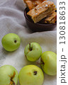 Apple pie with powdered sugar with green apples. Autumn dessert. Homemade dessert. Apple pie with cinnamon and fresh apple fruits. Country still life. Sweet dessert. Homely vibes.  130818633