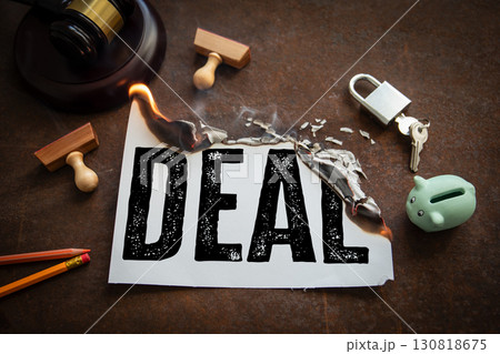 Burning canceled business deal with broken agreement symbolism Burning canceled business deal with broken agreement symbolism 130818675
