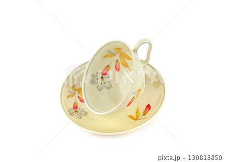 A Vintage Teacup and Saucer with a Floral Pattern A Vintage Teacup and Saucer with a Floral Pattern 130818850