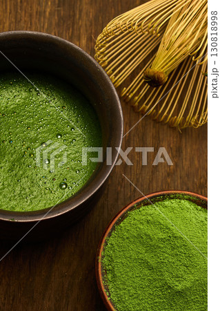 Matcha Tea and Whisk. A serene setup of matcha tea 130818998