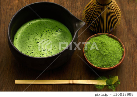Traditional Matcha Tea Setup with a bowl, whisk, and bamboo scoop on 130818999