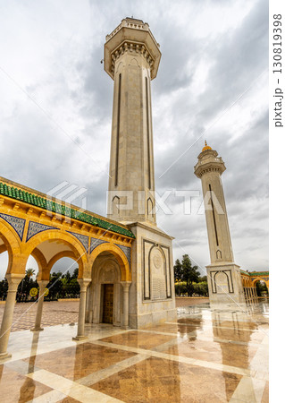 Two minarets tower of mausoleum of Habib Bourguiba on a cloudy day with decorated marble courtyard, Monastir, Tunisia 130819398