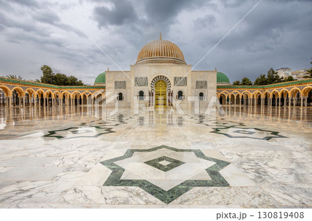 Mausoleum of Habib Bourguiba on a cloudy day with decorated marble courtyard, Monastir Mausoleum of Habib Bourguiba on a cloudy day with decorated marble courtyard, Monastir 130819408