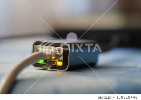 Ethernet cable adapter. Working ethernet cable adapter with green and yellow LED Ethernet cable adapter. Working ethernet cable adapter with green and yellow LED 130819448