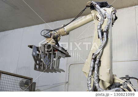 Robotic Arms at Modern Factory. Robotic Arms at Modern Factory. 130821099