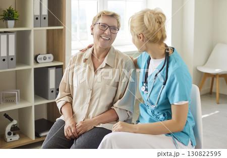Friendly conversation of nurse and senior woman, consultation for patient Friendly conversation of nurse and senior woman, consultation for patient 130822595