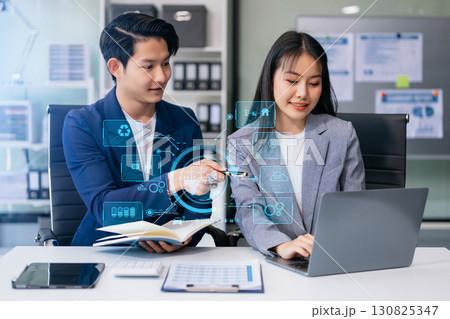 Business team working virtual modern smartphone to reduce CO2 emissions carbon footprint climate change to limit global warming.Sustainable development and green business concept. 130825347