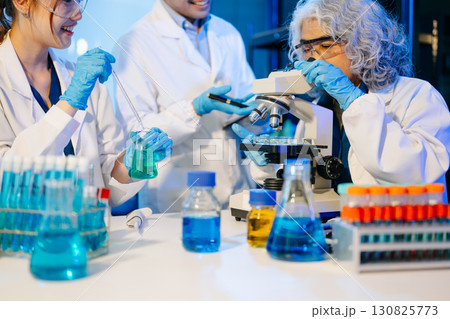 Scientist team meeting and writing analysis results in the laboratory study Scientist team meeting and writing analysis results in the laboratory study 130825773