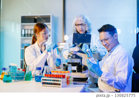 Scientist team meeting and writing analysis results in the laboratory study Scientist team meeting and writing analysis results in the laboratory study 130825775