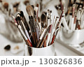 Makeup artist tools glass with brushes. Close-up 130826836