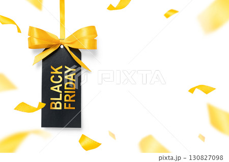 Black Friday label with yellow bow and festive confetti on bright white background. Perfect for seasonal sale banners and ecommerce promotion 130827098