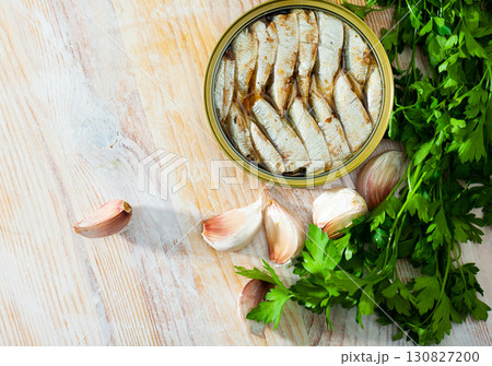 Tasty small sardines in oil from Baltic sea, greens and garlic 130827200
