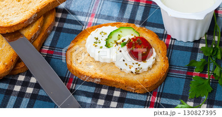 Apetizing canape with young white cheese 130827395