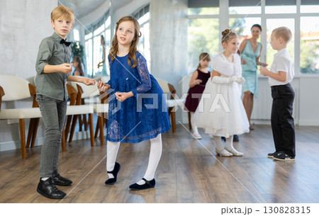 Beautifully dressed little boys and girls dance couple twist dance Beautifully dressed little boys and girls dance couple twist dance 130828315