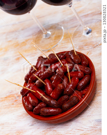 Spanish appetizer, warm mini chorizo sausages Spanish appetizer, warm mini chorizo sausages 130828321