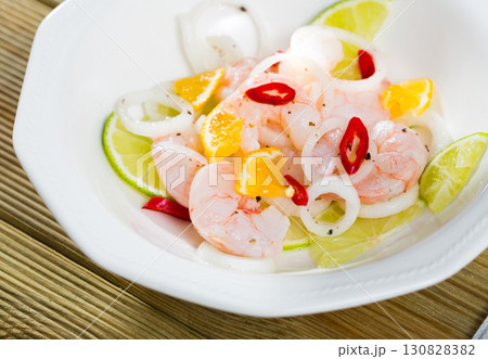 Shrimp ceviche with lime, mandarine and chili pepper 130828382