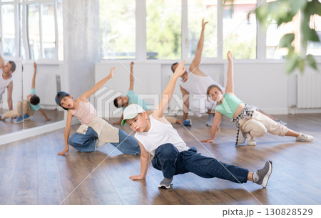 Preteen boy honing hip hop dance moves in choreographic studio 130828529