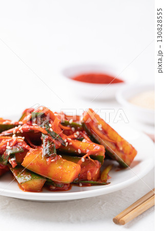 Korean kimchi cucumber on white plate, Korean side dish, Homemade food 130828555