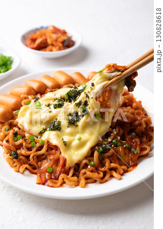 Korean spicy instant noodles with kimchi, sausage and Mozzarella cheese 130828618