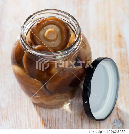 Open glass jar with natural shiitake mushrooms Open glass jar with natural shiitake mushrooms 130828682