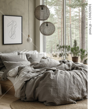Serene Bedroom Interior With Gray Bedding Near Window Overlooking Forest Scene 130828901